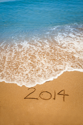 Year 2014 written in sand on tropical beach